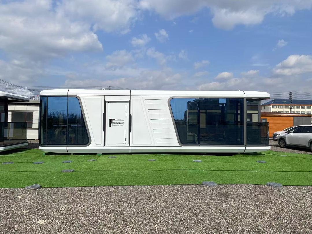 Space Capsule house in green landscape